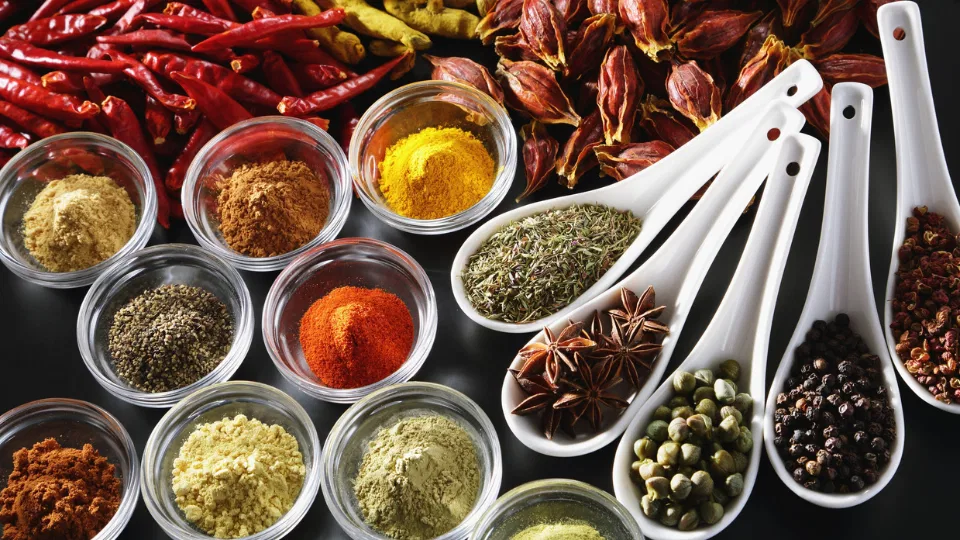 Natural ingredients such as cinnamon and herbs displayed on a kitchen counter